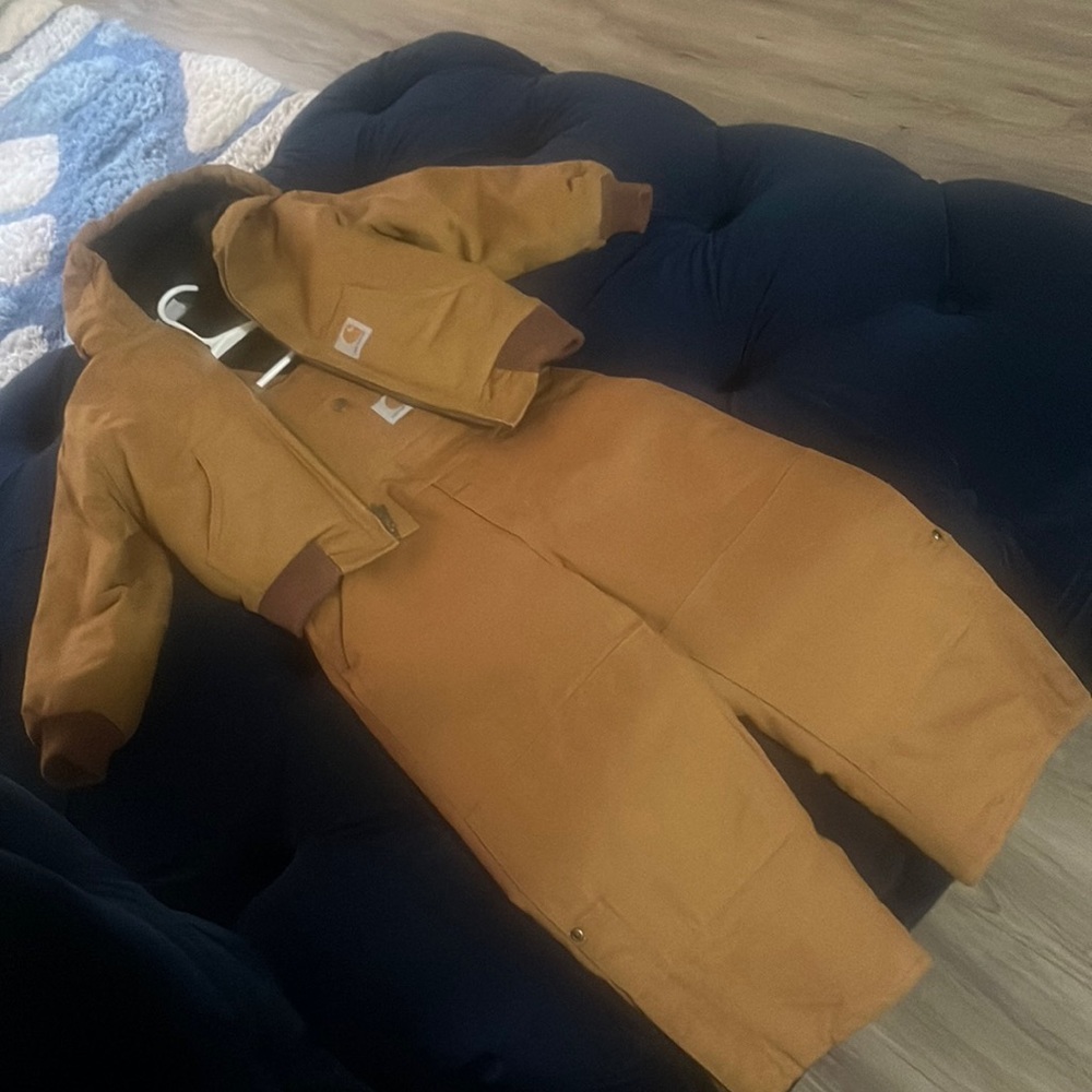 Brown Carhartt insulated Jacket and jumpsuit.